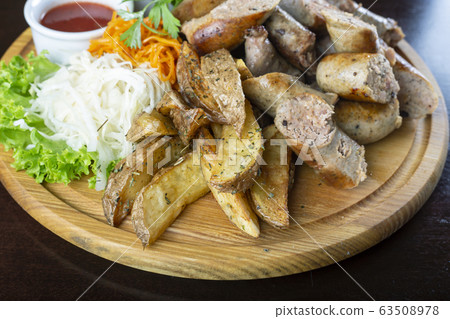 Homemade grilled sausages with sauerkraut and Homemade grilled sausages with sauerkraut and 63508978