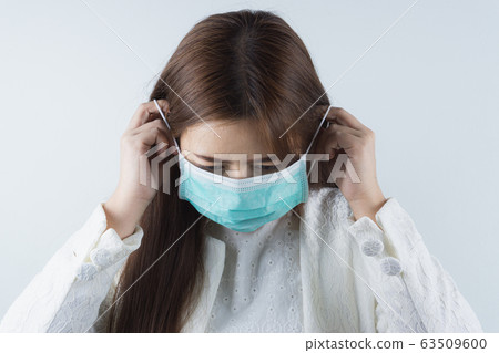 The business woman wearing protection face mask The business woman wearing protection face mask 63509600