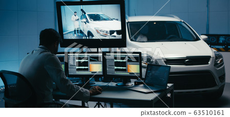 Engineers working in test chamber 63510161