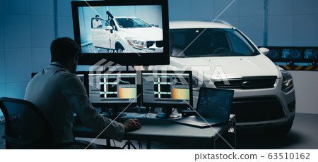 Engineers working in test chamber 63510162