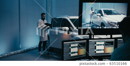 Engineers working in test chamber 63510166
