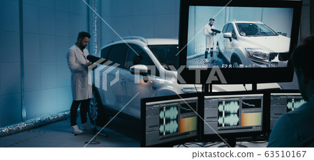 Engineers working in test chamber Engineers working in test chamber 63510167