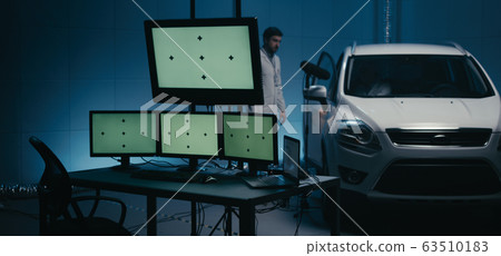 Engineers working in test chamber 63510183
