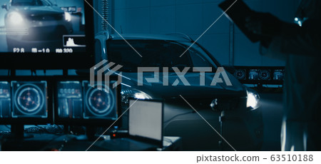 Engineers working in test chamber Engineers working in test chamber 63510188