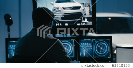Engineers working in test chamber 63510193