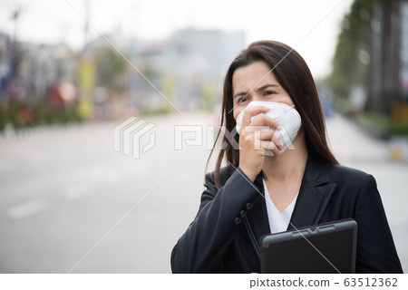 Close up of a businesswoman in a suit Close up of a businesswoman in a suit 63512362