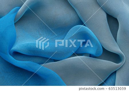 Blue draped silk fabric or scarf. Silk waves Blue draped silk fabric or scarf. Silk waves 63513039
