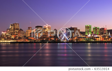 Montreal skyline illuminated at dusk reflected in Saint Lawrence River, Quebec, Canada Montreal skyline illuminated at dusk reflected in Saint Lawrence River, Quebec, Canada 63513914