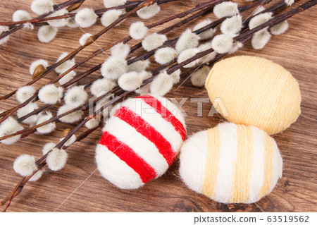 Twigs of willow and colorful Easter eggs 63519562