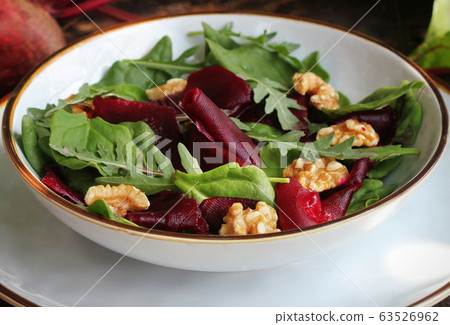 Save Download Preview Vegetarian food. Healthy Beet Salad with fresh sweet baby spinach, arugula, nuts 63526962