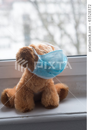 Closeup of plush with medical mask confined Closeup of plush with medical mask confined 63528372