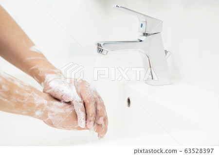 Men are washing their hands every time before eating Men are washing their hands every time before eating 63528397