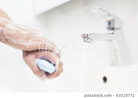Men are washing their hands every time before eating Men are washing their hands every time before eating 63528772
