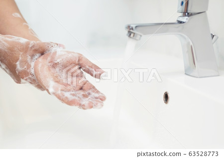 Men are washing their hands every time before eating 63528773
