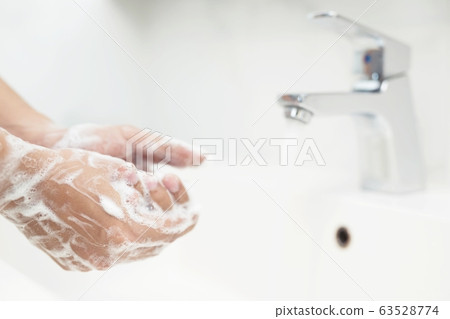 Men are washing their hands every time before eating Men are washing their hands every time before eating 63528774