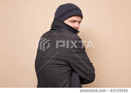 Young caucasian speculator man gangster or bandit 63529385