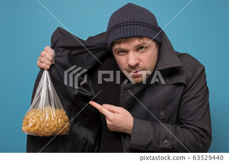 Smuggler selling food. Dealer in hat and coat Smuggler selling food. Dealer in hat and coat 63529440