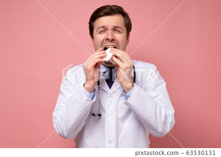 Young caucasian man doctor with stethoscope Young caucasian man doctor with stethoscope 63530131
