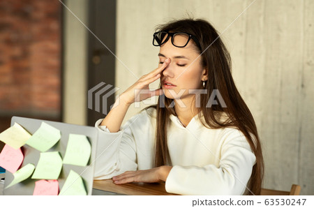 Tired concept. Freelancer girl can not concentrate Tired concept. Freelancer girl can not concentrate 63530247