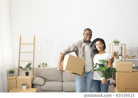 Young couple moving to a new apartment Young couple moving to a new apartment 63530515