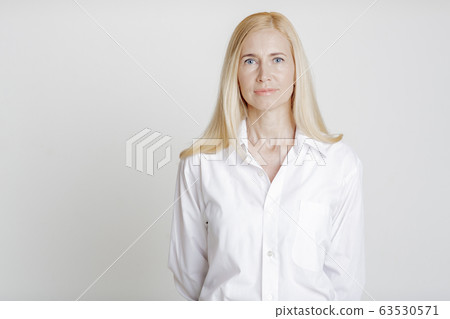 Elegant Mid Adult Lady Looking At Camera 63530571