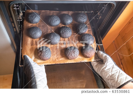 Woman has forogotten about preparing dinner. Burnt 63530861