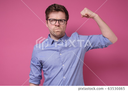 Attractive young man in glasses and blue shirt Attractive young man in glasses and blue shirt 63530865
