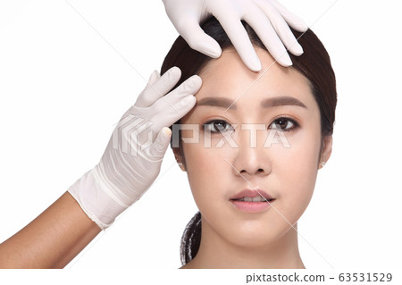Doctor injects Filler Botox to Asian Woman Beauty Face who want to be most beautiful girl and avoid cosmetic medical plastic surgery, portrait smile with close up face, isolated white background Doctor injects Filler Botox to Asian Woman Beauty Face who want to be most beautiful girl and avoid cosmetic medical plastic surgery, portrait smile with close up face, isolated white background 63531529