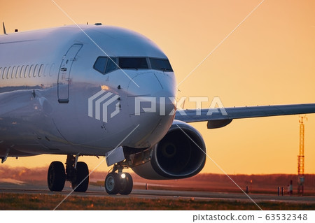 Airplane on airport runway 63532348