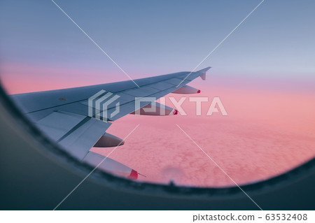 Airplane during flight above clouds Airplane during flight above clouds 63532408