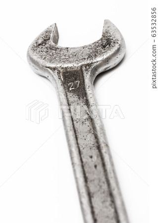 old wrench on white background 63532856