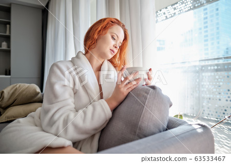 stayhome concept, attractivewoman sitting in bed stayhome concept, attractivewoman sitting in bed 63533467