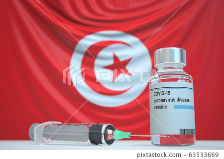 COVID-19 coronavirus disease vaccine vial and syringe against the Tunisian flag. Medical research and vaccination in Tunisia, 3D rendering COVID-19 coronavirus disease vaccine vial and syringe against the Tunisian flag. Medical research and vaccination in Tunisia, 3D rendering 63533669
