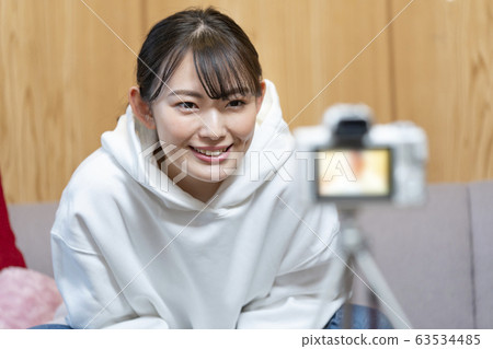 Woman shooting video YouTuber Image Woman shooting video YouTuber Image 63534485