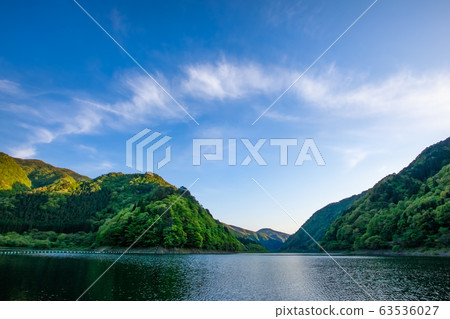 Tateiwa dam lake, sky and clouds landscape. Since it is a heavy snowfall area in winter, it is a rugged place that cannot be passed. Tateiwa dam lake, sky and clouds landscape. Since it is a heavy snowfall area in winter, it is a rugged place that cannot be passed. 63536027