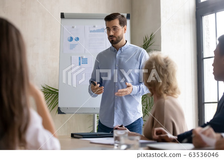 Male Caucasian speaker make whiteboard presentation at office Male Caucasian speaker make whiteboard presentation at office 63536046