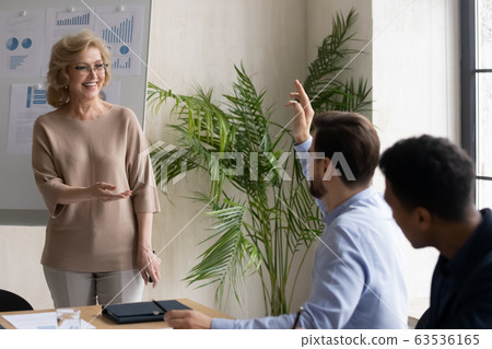 Businesswoman interact with active employee at briefing 63536165