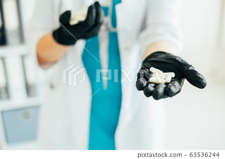 Medicine and medication. Doctor with pills 63536244