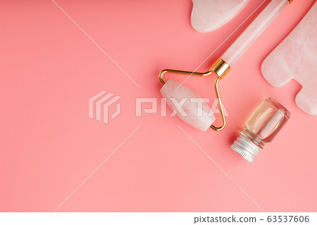 Gua sha massage tool made of natural pink Gua sha massage tool made of natural pink 63537606