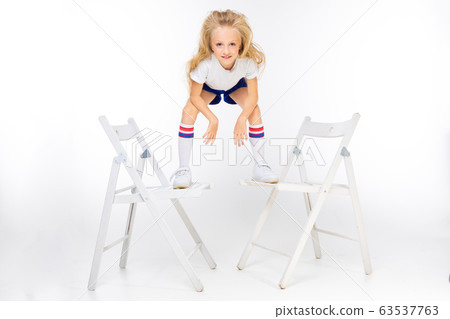 teenager girl in sports shorts on a white background 63537763