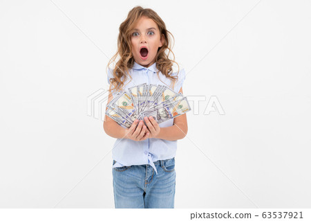 teenage girl received a cash prize on a white background with copy space teenage girl received a cash prize on a white background with copy space 63537921