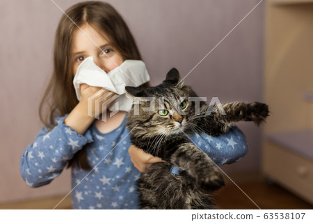 Little girl with tissue and pet on background. 63538107