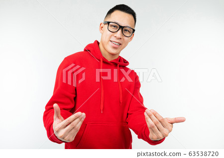 beautiful brunette asian in red sweater and glasses for vision poses on a white background beautiful brunette asian in red sweater and glasses for vision poses on a white background 63538720