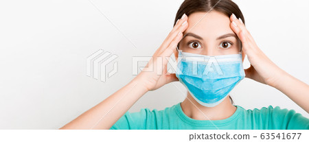 Portrait of young shocked woman wearing medical 63541677
