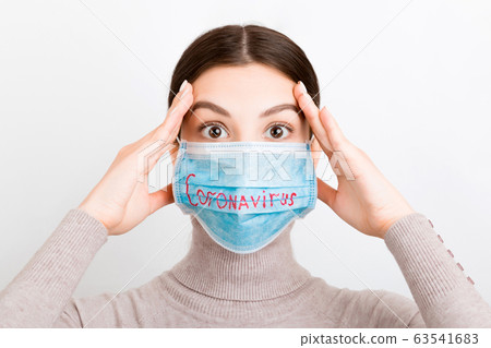 Portrait of pretty shocked woman wearing medical Portrait of pretty shocked woman wearing medical 63541683