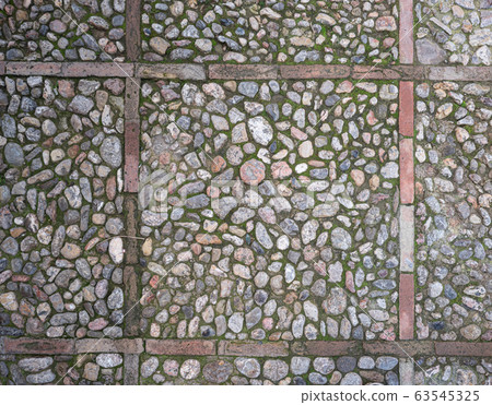 Historical footpath. Old pavement from rounded 63545325