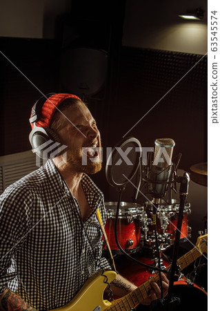 awesome musician play electric guitar and sing awesome musician play electric guitar and sing 63545574