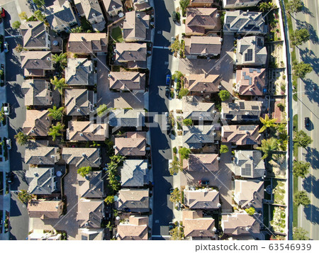 Aerial top view of upper middle class neighborhood with residential house next to each other Aerial top view of upper middle class neighborhood with residential house next to each other 63546939