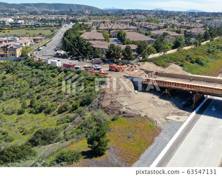 Aerial view of bridge construction crossing the highway 63547131