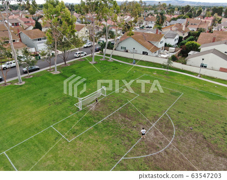 Aerial view of large-scale residential neighborhood with small park, Irvine, California Aerial view of large-scale residential neighborhood with small park, Irvine, California 63547203